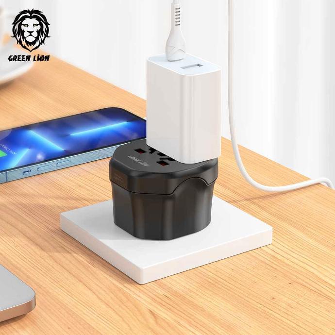 alt="  there is wood desk with black plug that charging phone
