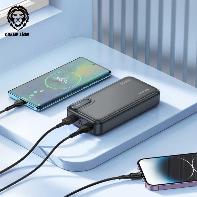 alt=" there is blue background that a black power bank is charging 2 phones at the same time
