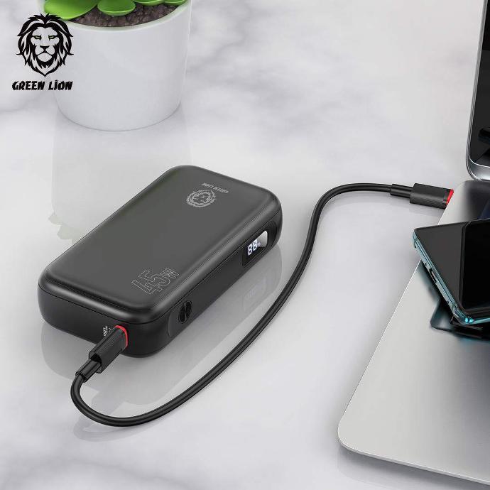 alt=" there is a black compact power bank that connected to gray laptop